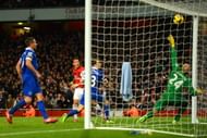 LONDON, ENGLAND - DECEMBER 08:  Mesut Oezil of Arsenal scores their first goal past Tim Howard of Everton during the Barclays Premier League match between Arsenal and Everton at Emirates Stadium on December 8, 2013 in London, England.  (Photo by Michael Regan/Getty Images)